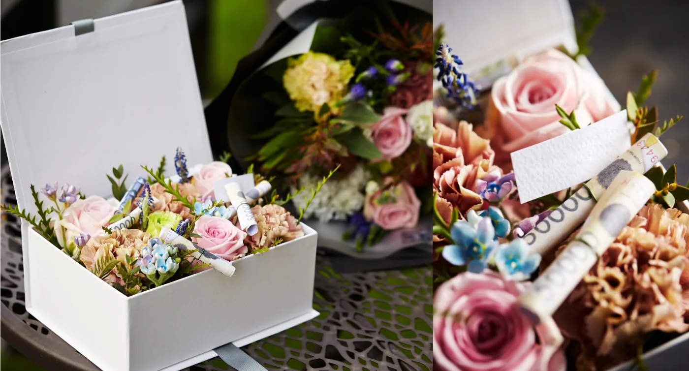 biały flower box z różami i banknotami